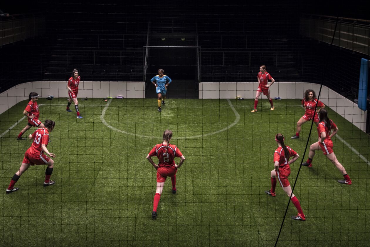 The cast warms up in a scene from “The Wolves” at the Goodman Theatre. | Liz Lauren